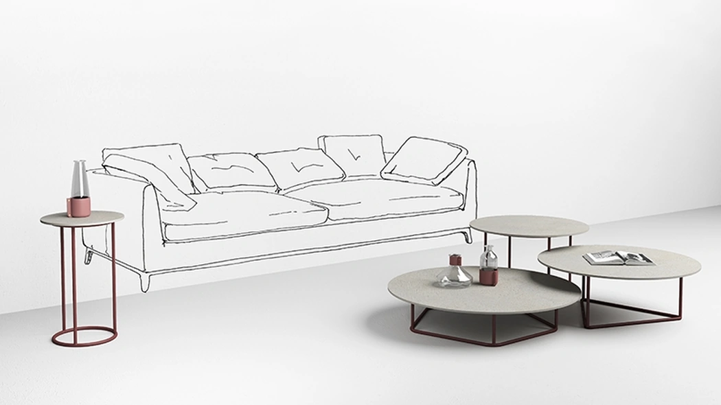 Tavolini con top in cemento bianco Circus di Minotti Italia