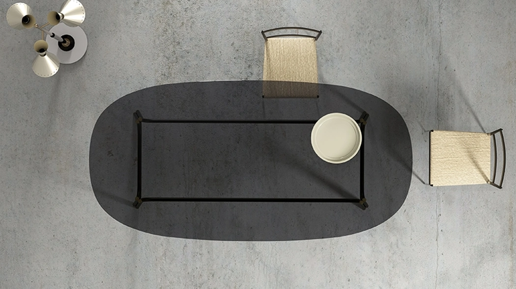 Tavolo Tubi con top in cristallo e base in tubolare di ferro di Minotti Italia